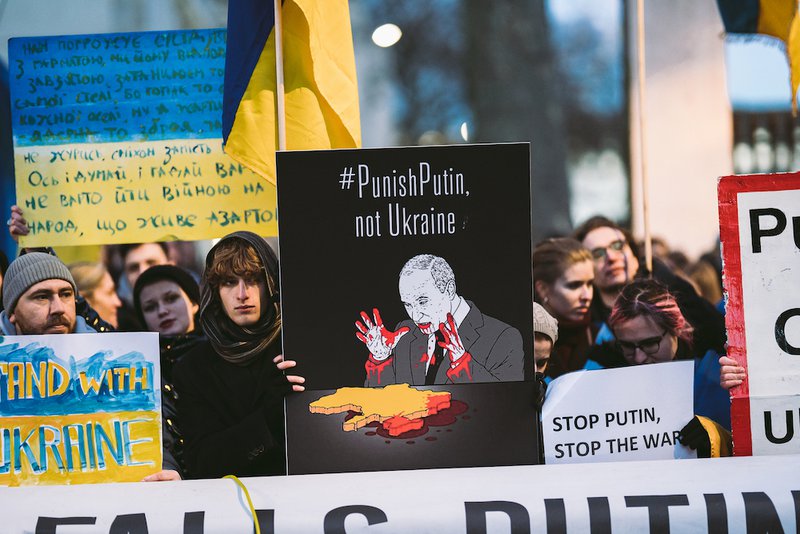 Stop Genocide - Downing Street, London | UK -  2022.02.24: Ukraine people protest, thousands gather to demand tougher sanctions on Russia from British Government 